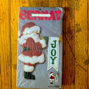 Bernat Felt Wall Hanging Kit. Title is Santa’s Trumpet.